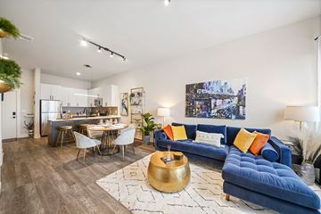 Lansdale apartment for rent - A living room with a blue couch and a coffee table.