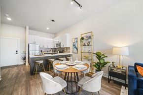 Lansdale apartment for rent - A modern kitchen with a dining table set for four.
