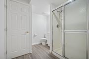Philadelphia apartment for rent - A white door is on the left and a glass shower door is on the right.