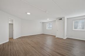Philadelphia apartment for rent - A room with wooden flooring and white walls.