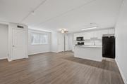 Philadelphia apartment for rent - A spacious room with wooden flooring and white walls.