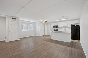 Philadelphia apartment for rent - A spacious room with wooden flooring and white walls.