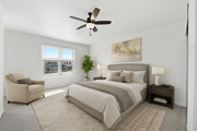 Philadelphia townhouse for rent - A bedroom with a large bed, a chair, and a ceiling fan.