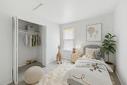 Philadelphia townhouse for rent - A bedroom with a bed, a giraffe toy, a potted plant, and a wardrobe.