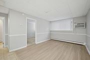 Philadelphia apartment for rent - A room with a wooden floor and white walls.