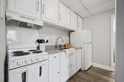Philadelphia apartment for rent - A white kitchen with a stove, oven, and refrigerator.