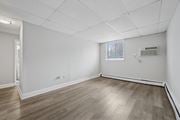 Philadelphia apartment for rent - A room with wooden flooring and white walls.