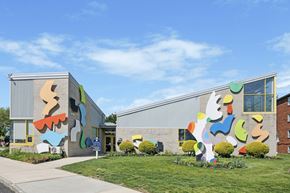 Philadelphia apartment for rent - A colorful building with a mural on the side.