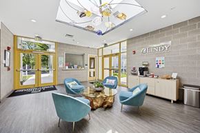 Philadelphia apartment for rent - A reception area with blue chairs and a sign that says "Zindy".