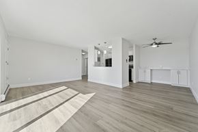Philadelphia apartment for rent - A spacious room with sunlight pouring in through the balcony door.