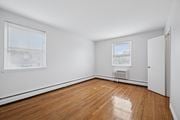 Philadelphia apartment for rent - A room with wooden flooring and a window with blinds.
