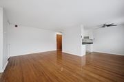 Philadelphia apartment for rent - A room with wooden floors and a ceiling fan.