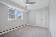 Philadelphia apartment for rent - A room with a window, a ceiling fan, and two doors.