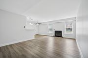 Huntingdon Valley apartment for rent - A spacious room with a fireplace and wood flooring.