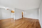 Philadelphia apartment for rent - A room with wooden floors and a ceiling fan.