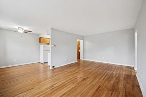 Philadelphia apartment for rent - A room with wooden floors and a ceiling fan.