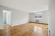 Philadelphia apartment for rent - A room with wooden floors and white walls.