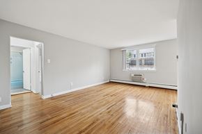 Philadelphia apartment for rent - A room with wooden floors and white walls.