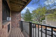 Philadelphia apartment for rent - A balcony with a black railing and a brick wall.