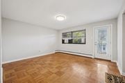 Philadelphia apartment for rent - A room with a wooden floor and a door leading outside.