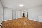 Philadelphia apartment for rent - A room with wooden flooring and white walls.