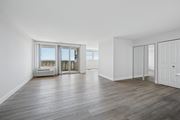 Wyncote apartment for rent - A spacious room with wooden flooring and white walls.