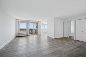 Wyncote apartment for rent - A spacious room with wooden flooring and white walls.