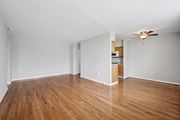 Philadelphia apartment for rent - A room with wooden floors and a ceiling fan.