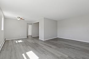 Warrington apartment for rent - A room with a ceiling fan and light fixture.