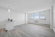 Philadelphia apartment for rent - A room with a window and a desk with a plant on it.