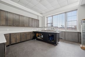 Philadelphia apartment for rent - A kitchen with brown cabinets and a white countertop.