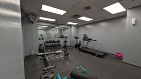 Omaha apartment for rent - a gym with weights and other exercise equipment in a building