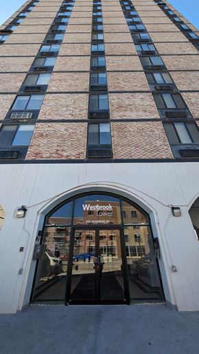 Omaha apartment for rent - a view of the front of a building with a sign in the front door