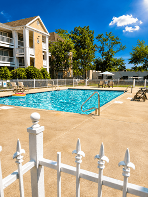 Kansas City apartment for rent - A white fence surrounds a small pool.