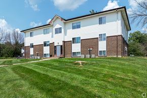 Maryville apartment for rent - a large white building with a green lawn