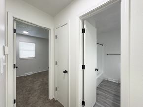 Blue Springs apartment for rent - a bedroom with a closet and a door to a bathroom