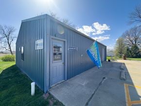 Maryville apartment for rent - a small building with a flag in front of it next to Northwest Missouri State University