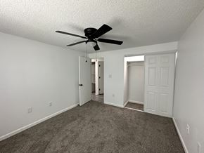 Kansas City apartment for rent - an empty bedroom with a ceiling fan