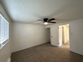 Kansas City apartment for rent - an empty bedroom with a ceiling fan