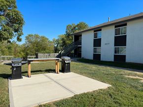 Riverside apartment for rent - a picnic table in front of a building