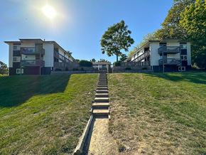 Riverside apartment for rent - a row of steps leading up to an apartment building