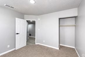 Maryville apartment for rent - an empty bedroom with a closet and a door to a hallway
