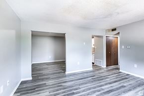 Maryville apartment for rent - an empty living room with wood floors and white walls