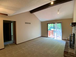 Overland Park apartment for rent - large carpeted room with patio door