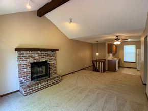 Overland Park apartment for rent - large carpeted room with fireplace