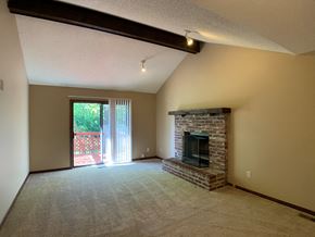Overland Park apartment for rent - large carpeted room with fireplace