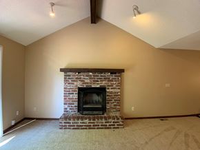 Overland Park apartment for rent - Large carpeted room with fireplace