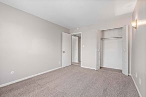 Kansas City apartment for rent - A room with carpeted floor and two doors.