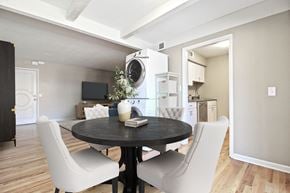 Kansas City apartment for rent - A modern dining room with a round table and white chairs.