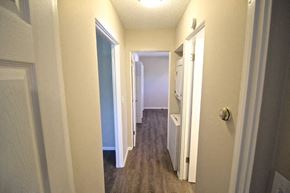 Kansas City apartment for rent - A hallway with a white door on the right and a white door on the left.